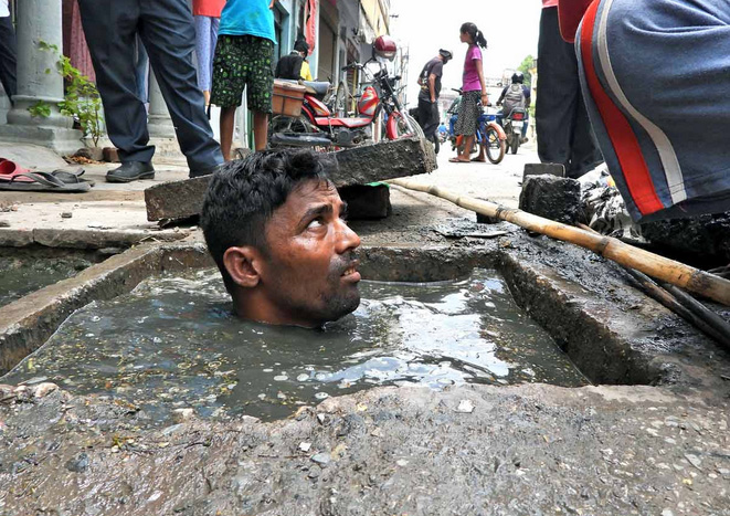 Indian bathing in sewage